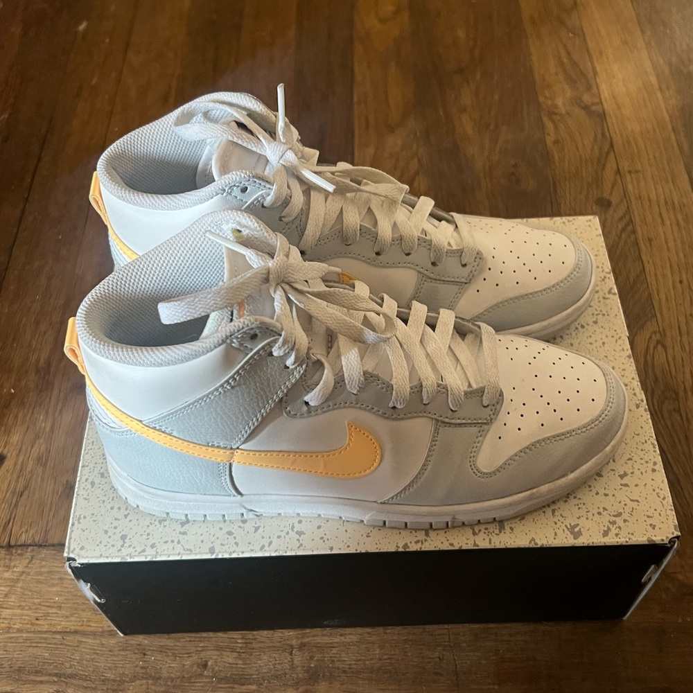 White and Gray Sneakers with Orange swoosh